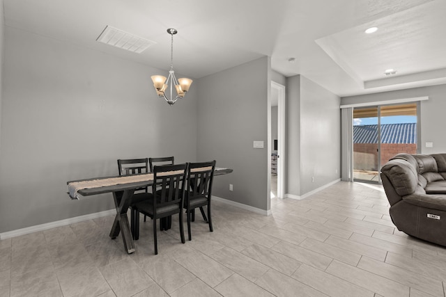 dining room featuring a chandelier