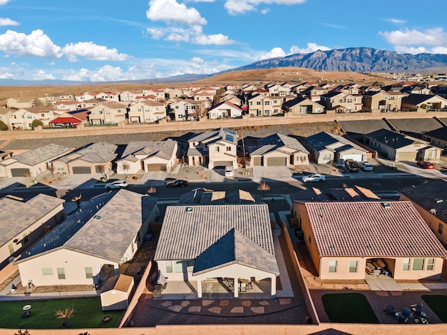 birds eye view of property with a mountain view