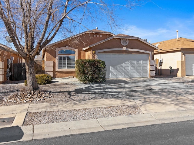 ranch-style house featuring a garage