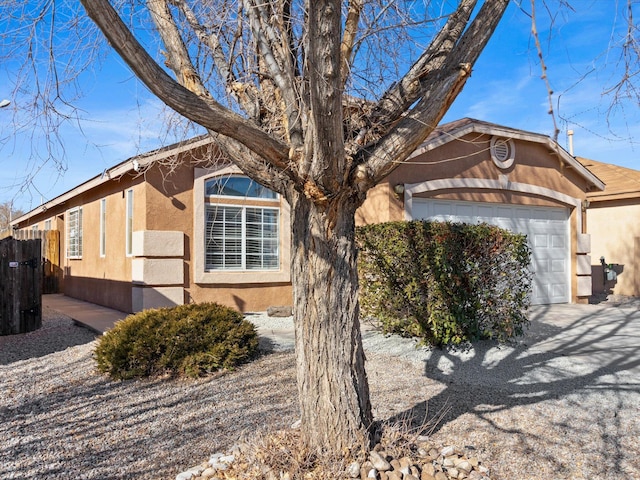 single story home featuring a garage