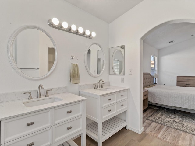 bathroom with wood-type flooring and vanity