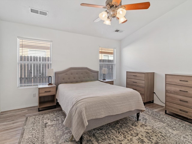 bedroom featuring ceiling fan and light hardwood / wood-style flooring