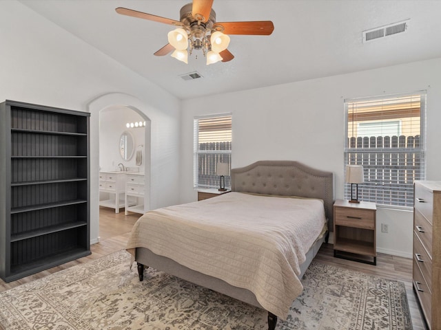 bedroom with ceiling fan and light wood-type flooring