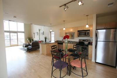 dining area with light hardwood / wood-style floors