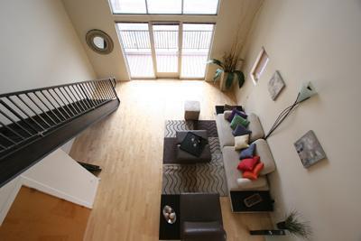 living room featuring a towering ceiling