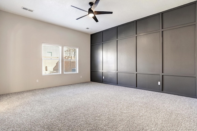 unfurnished bedroom with carpet flooring and ceiling fan