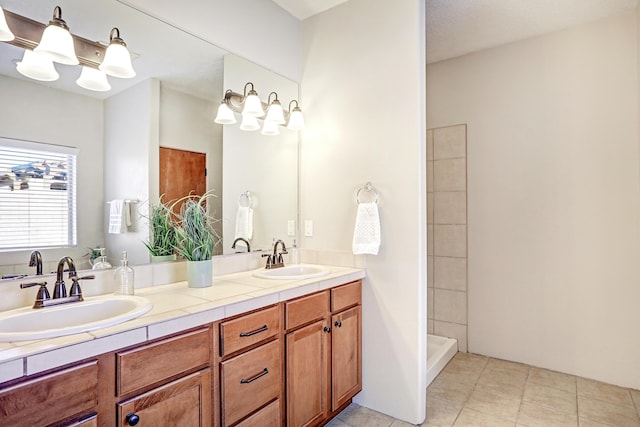 bathroom with walk in shower, tile patterned floors, and vanity