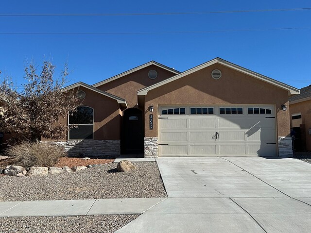 single story home featuring a garage