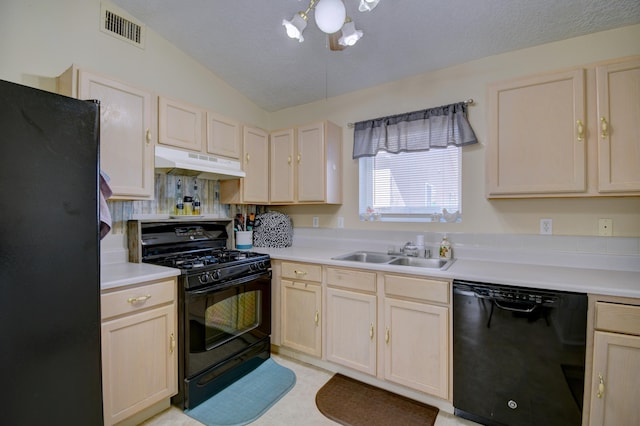 kitchen featuring tasteful backsplash, lofted ceiling, sink, and black appliances