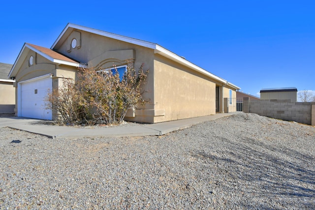 view of property exterior with a garage