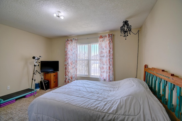 carpeted bedroom with a textured ceiling