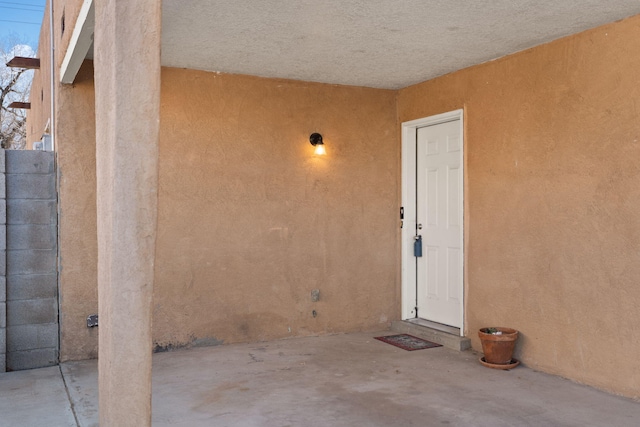 doorway to property featuring a patio