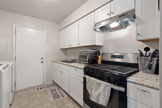 kitchen featuring washer and dryer, sink, white cabinetry, and stainless steel range with gas stovetop