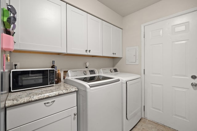 laundry area featuring cabinets and independent washer and dryer