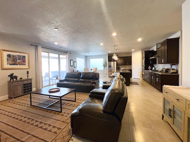 tiled living room with a textured ceiling