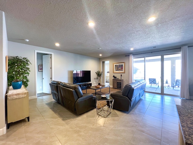 tiled living room with a textured ceiling