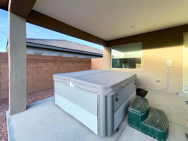 view of patio with a hot tub