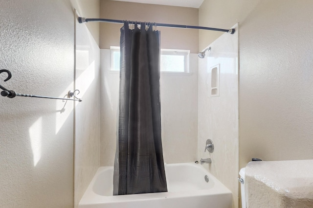 full bath featuring shower / tub combo with curtain