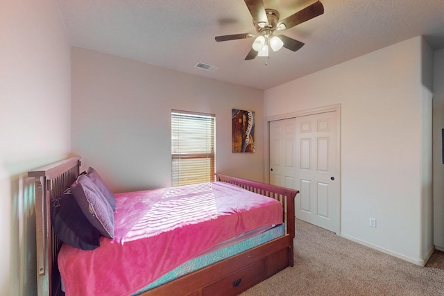 bedroom featuring light colored carpet, visible vents, ceiling fan, and baseboards