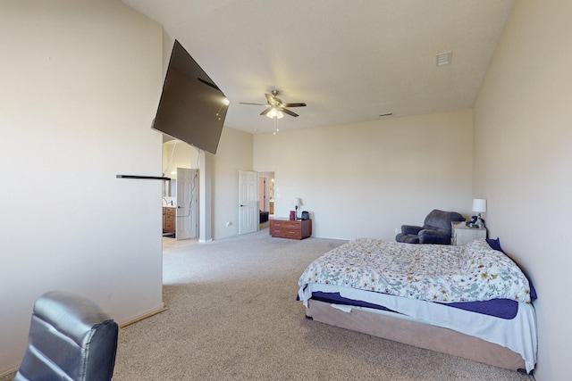 carpeted bedroom with a ceiling fan and baseboards