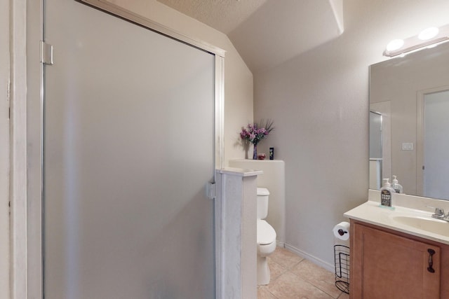 full bathroom with toilet, vaulted ceiling, vanity, baseboards, and tile patterned floors