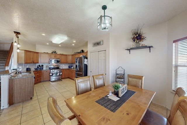 dining area featuring light tile patterned floors, stairway, a textured ceiling, and recessed lighting