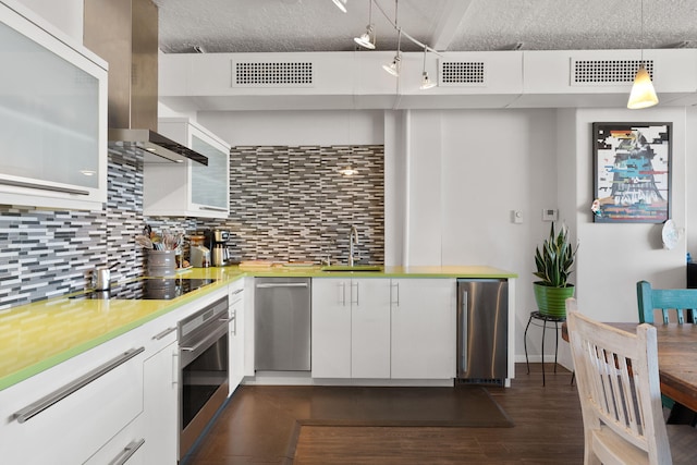 kitchen with stainless steel appliances, decorative light fixtures, and white cabinets