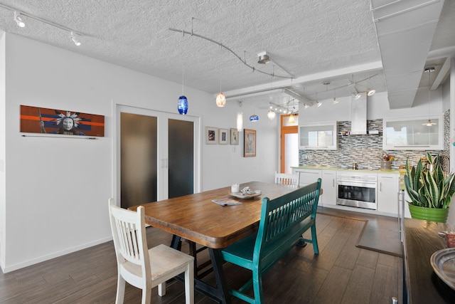 dining room with dark wood-type flooring