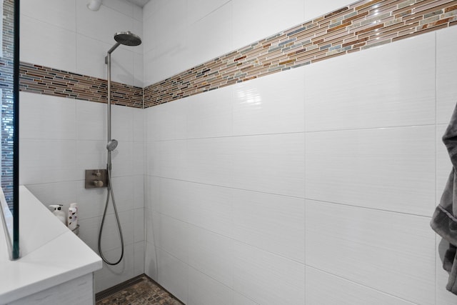 bathroom with a tile shower