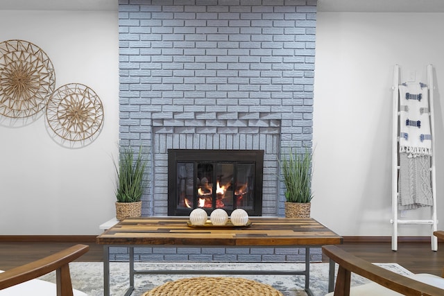 room details with hardwood / wood-style floors and a fireplace