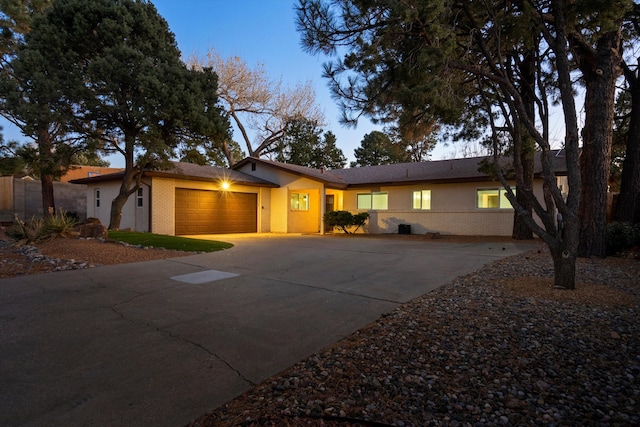 ranch-style home featuring a garage