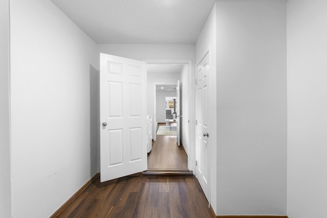 corridor featuring dark wood-type flooring