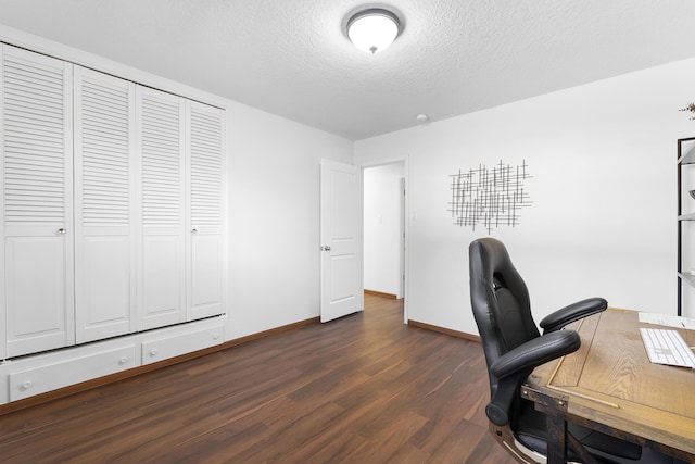 office space featuring dark hardwood / wood-style flooring and a textured ceiling