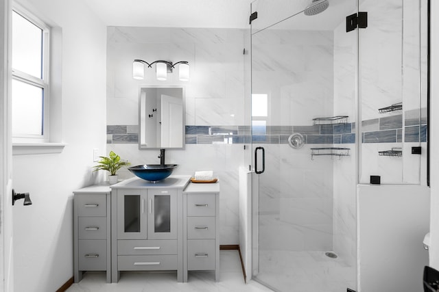 bathroom with vanity and an enclosed shower