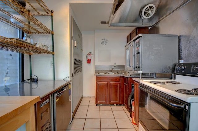 kitchen featuring dishwasher, light tile patterned floors, and electric range