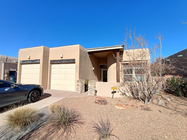 southwest-style home featuring a garage