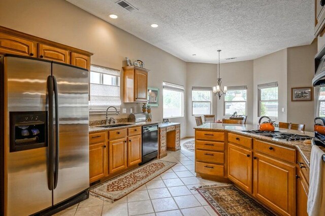 laundry room with cabinets, washing machine and dryer, and sink