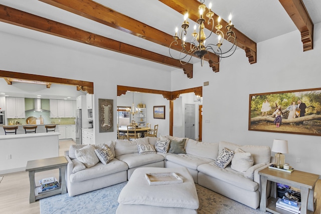 living room with beamed ceiling and a chandelier