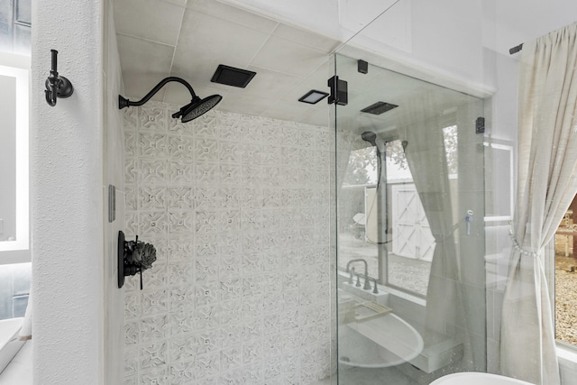 bathroom featuring walk in shower