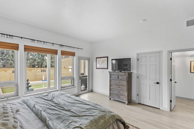 bedroom with light hardwood / wood-style flooring