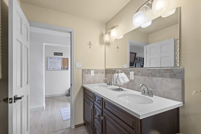 bathroom featuring vanity and a textured ceiling