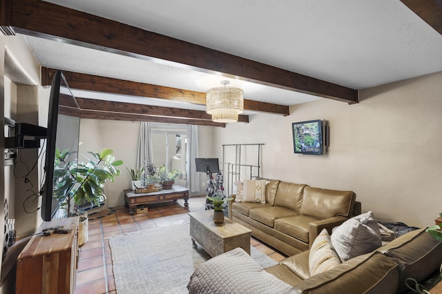 tiled living room featuring a chandelier and beam ceiling