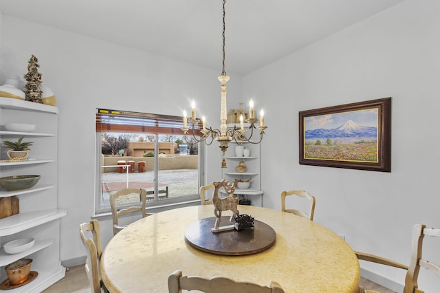 dining area featuring a notable chandelier