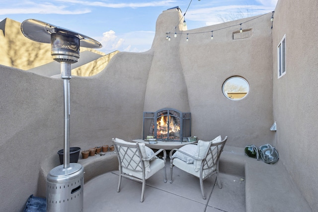 view of patio / terrace featuring an outdoor fireplace