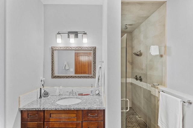 bathroom with vanity and an enclosed shower