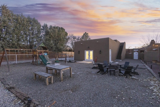 exterior space featuring a patio area, french doors, and a playground