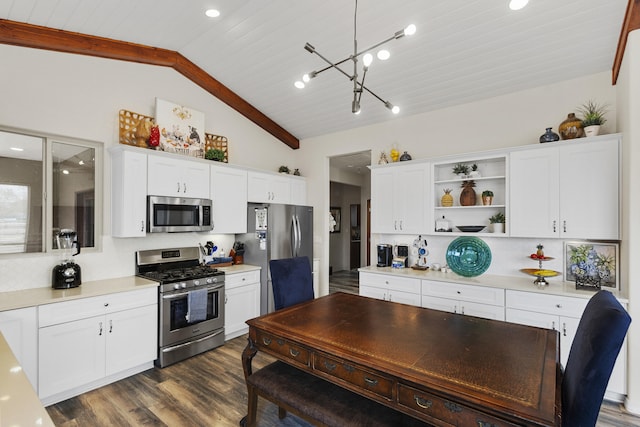 kitchen featuring white cabinetry, stainless steel appliances, dark hardwood / wood-style flooring, and pendant lighting