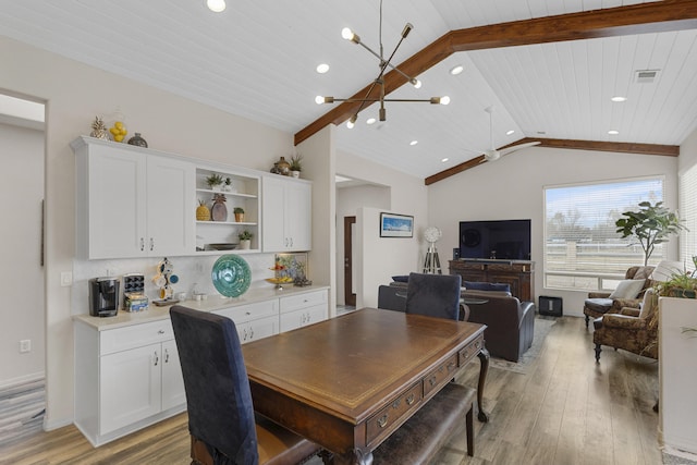 dining area with wood ceiling, vaulted ceiling, a chandelier, and light hardwood / wood-style floors