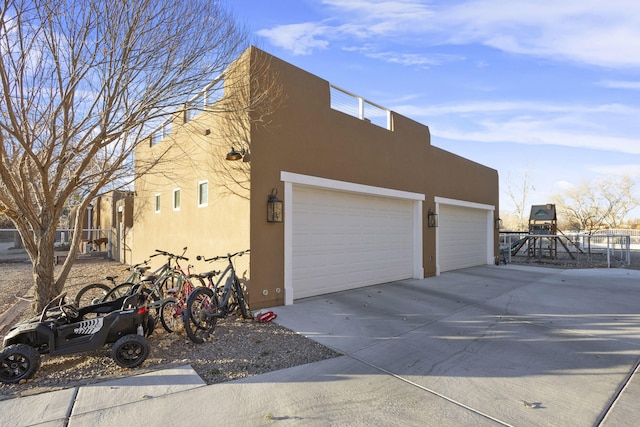 view of side of property with a garage