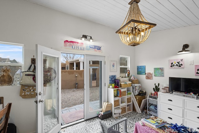 interior space with french doors, wooden ceiling, and a notable chandelier